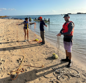 Staff practice tying boat knots.