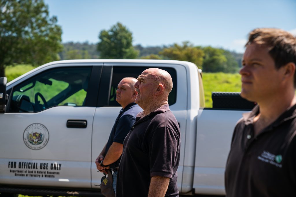 Forestry Program: Staff partnering with The Nature Conservancy pause for an oli kahea, asking permission to enter the forest on Hawaiʻi Island