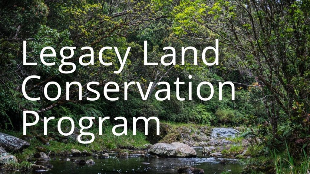 An image of a forest and stream linking to a page called Legacy Land Conservation Program