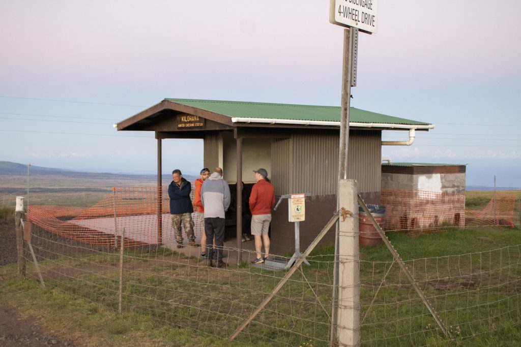 image of people in front of a hunter check station